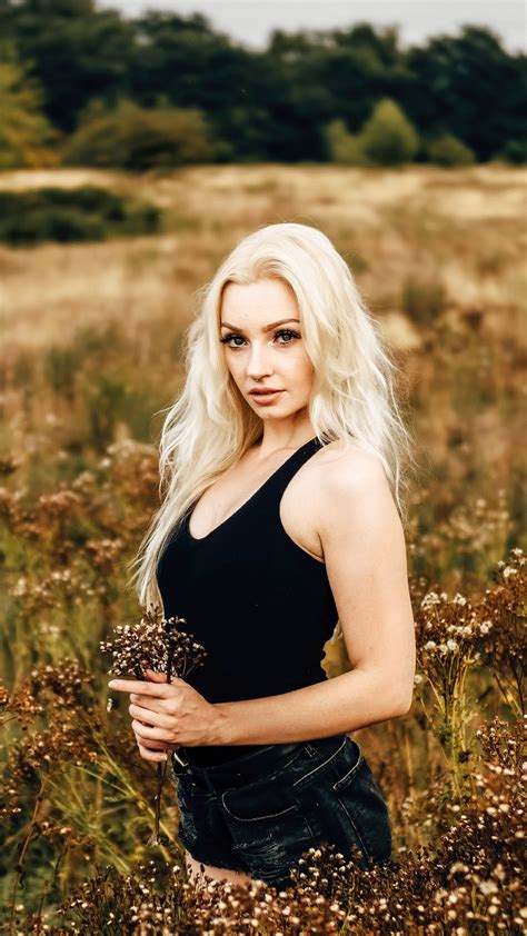 You will definitely choose from a huge number of pictures that option that will suit you exactly! Cute Girl Model Is Wearing Black Dress Standing On Green ...