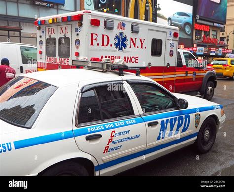 Fdny Ambulance Passing An Nypd Car Manhattan New York City Usa Stock