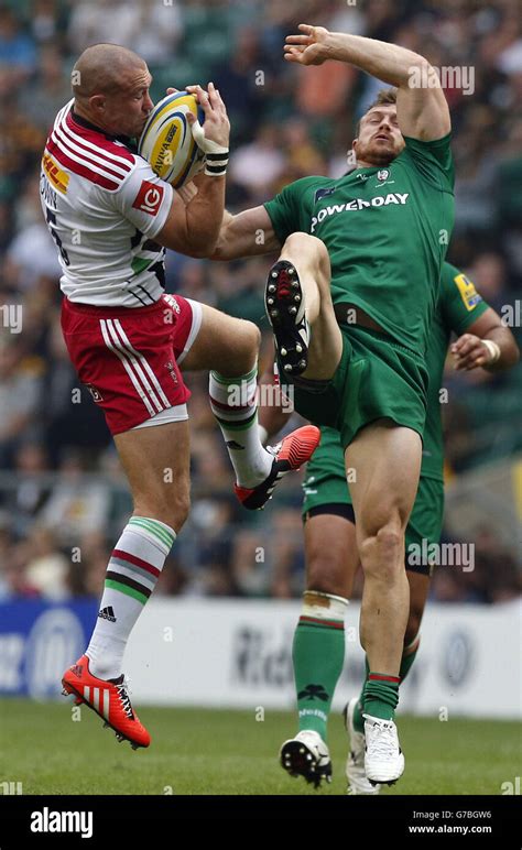 Harlequins Mike Brown Left Grapples With London Irishs James Short Right During The Aviva
