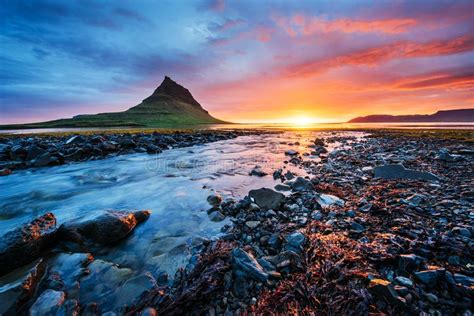 The Picturesque Sunset Over Landscapes And Waterfalls Kirkjufell