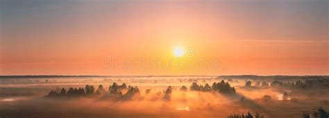 Amazing Sunrise Sunset Over Misty Landscape Scenic View Of Foggy