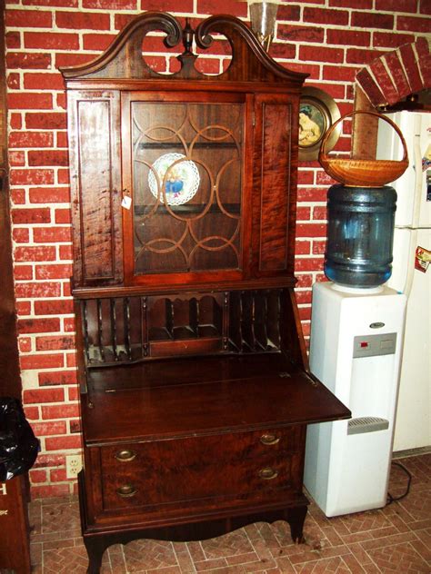 The desk is fitted with a cover, as well as a drawer and a cupboard underneath for additional storage. Antique Secretary Desk/Hutch by Union Furniture Co ...