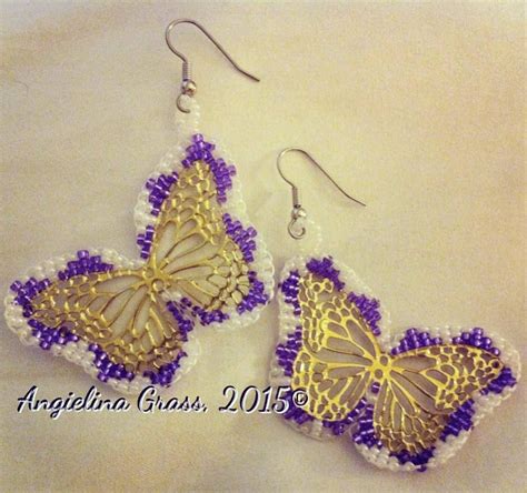 Two Yellow And Purple Butterflies Are Hanging From Earrings