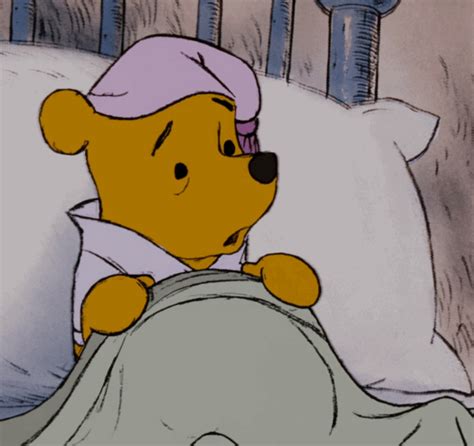 Winnie The Pooh Is Laying In Bed