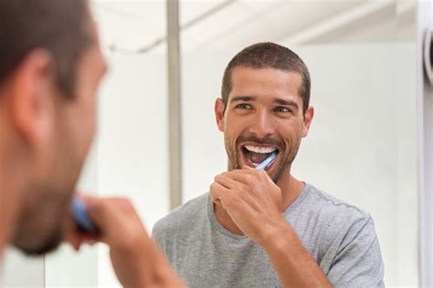 Are You Brushing Your Teeth Too Hard Quest Dental