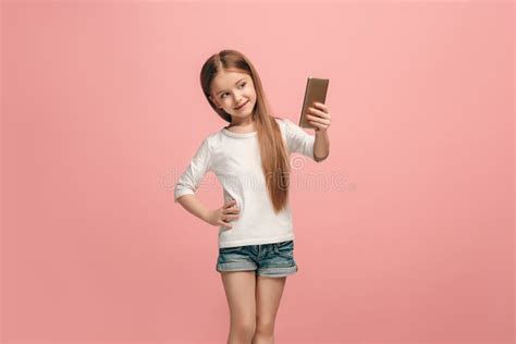 The Happy Teen Girl Making Selfie Photo By Mobile Phone Stock Image