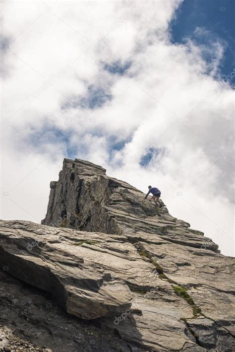 Free Mountain Climbing On Steep Rocky Slope — Stock Photo © Fbxx 74341873