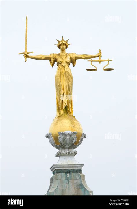 The Gold Bronze Lady Justice Statue With Sword And Scales Above The