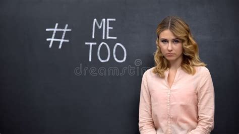 Distressed Woman Standing Near Metoo Hashtag Movement Against Sexual Assault Stock Image