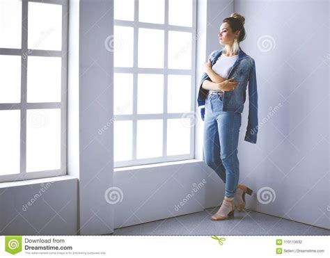 Beautiful Woman Portrait Standing Near Window On White Background