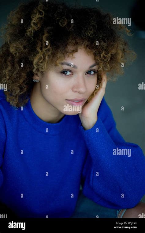 Portrait Of Woman Wearing Blue Pullover Stock Photo Alamy