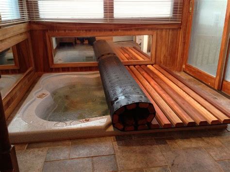 Create an elegant and modern centerpiece for your bathroom decor by choosing this universal tubs amber whirlpool tub. Hot Tub Spa Roll and Rolling Covers | Hot tub room, Hot ...
