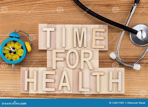 Time For Health Text In Vintage Letters On Wooden Blocks With Stock