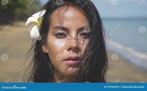 close up of a face of a beautiful asian girl walking along the beach stock video video of