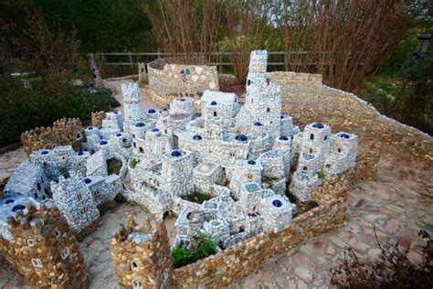 Miniature Village Made Of Rocks And Pebles In The Backyard