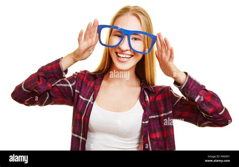 Happy Blonde Woman Holding Fake Glasses In Front Of Her Eyes Stock
