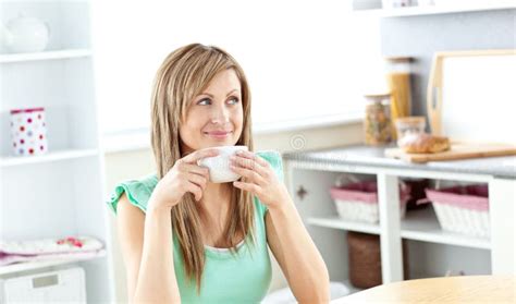 Caucasian Woman Drinking Coffee In The Kitchen Stock Photo Image Of