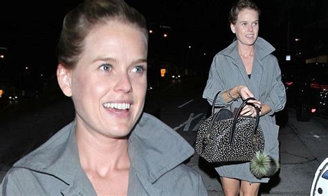 alice eve goes make up free while showcasing her legs in short trench coat daily mail online