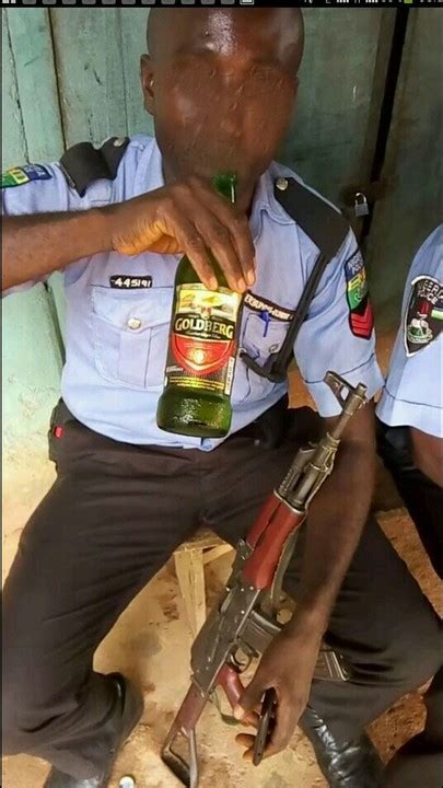 Nigerian Police Officers Spotted Drinking While With Gunsnigerians