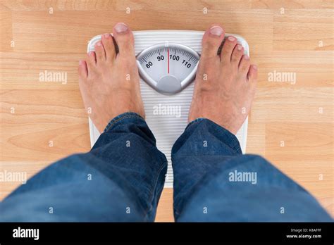 Person Standing On Scale Jeans Hi Res Stock Photography And Images Alamy