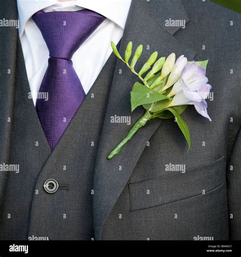 Button Hole Flower On A Grooms Jacket Stock Photo Alamy