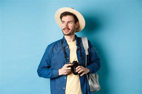 Handsome Positive Guy In Summer Hat Holding Photo Camera And Looking