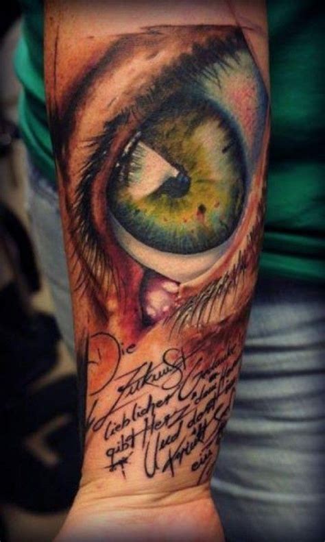 Green Eye And Inscription Tattoo On Arm Tattooimagesbiz