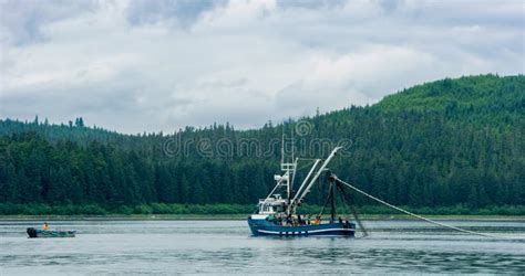 A Fishing Boat Sailing On The Lake Evergreen Forest In The Boreal Zone