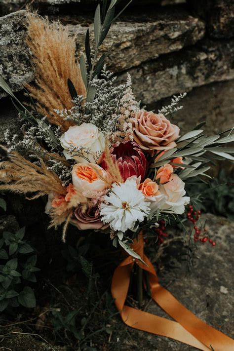 Boho Inspired Bridal Bouquet With Pampas Grass Coral Peonies Image