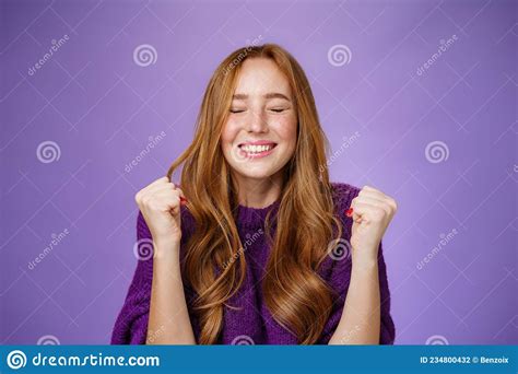 Finally I Won Portrait Of Relieved And Happy Triumphing Good Looking Redhead Woman Clenching