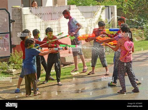 Children Play With Colors As They Celebrate Holi The Spring Festival
