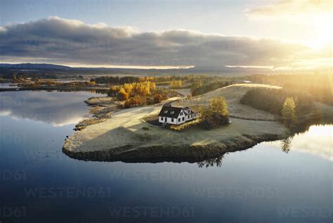 Farm House Near Lake During Sunset Stock Photo