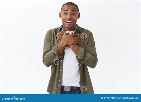 Portrait Of Touched Happy African American Man Sighing And Touching