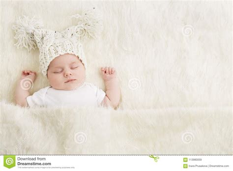 Sleeping Newborn Baby In Woolen Hat New Born Kid Sleep In Bed Stock