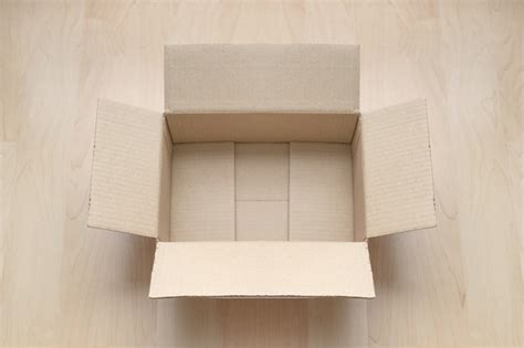 Premium Photo Empty Open Rectangular Cardboard Box On Wood