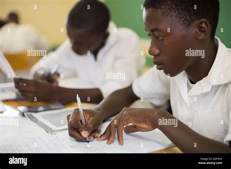 Secondary School Students Learning At Desks In Classroom In Oshana