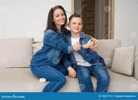 Portrait Of Mother And Her Son On Sofa At Home Stock Image Image Of