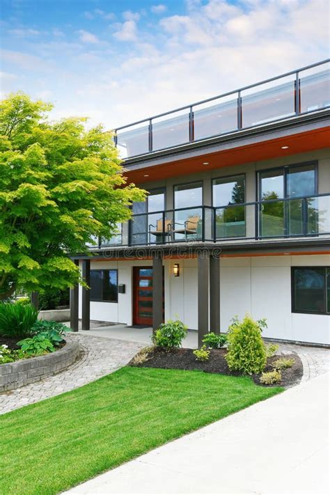 Modern Three Level House Exterior With Wooden Trim Stock Image Image