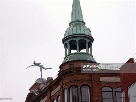 Bronze Statue Of Mercury On Old Pharmacy Building At Copenhagen Denmark