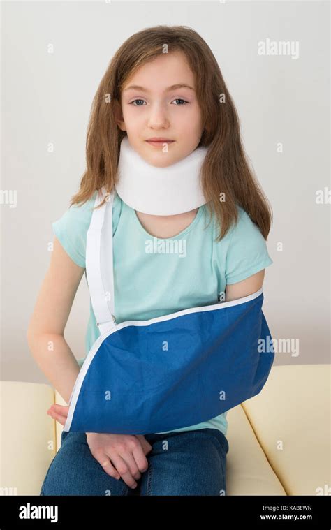 Portrait Of Girl Wearing Neck Brace And Arm Sling Stock Photo Alamy
