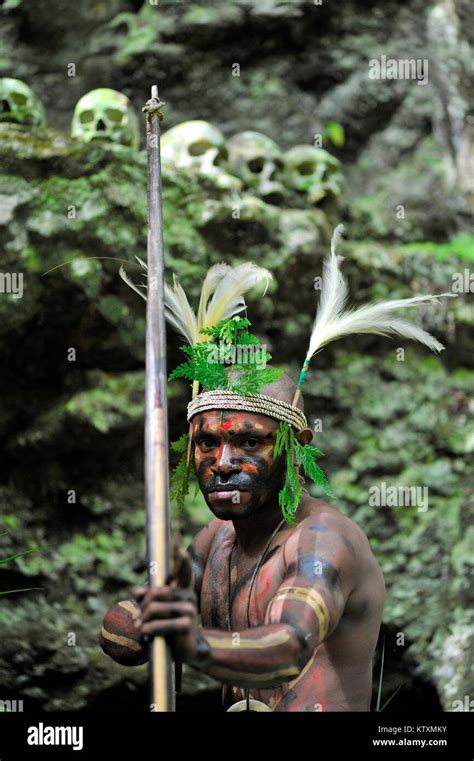 The Warrior Of A Papuan Tribe Of Yafi In Traditional Clothes Ornaments