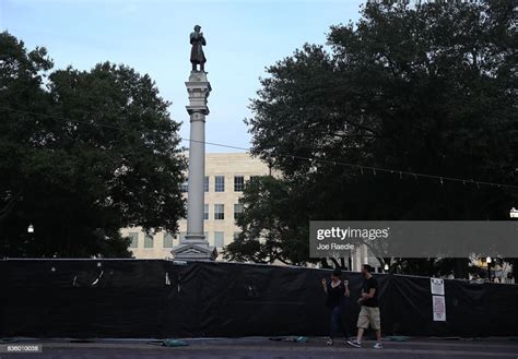 A Confederate Monument Featuring A Statue Of A Confederate Soldier Is
