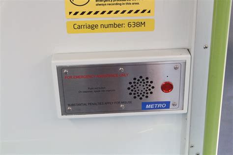 Blue Metro Sticker Across The Connex Branded Emergency Button Onboard