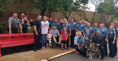 Police Officers Escort Son Of Fellow Cop Who Is Battling Cancer To