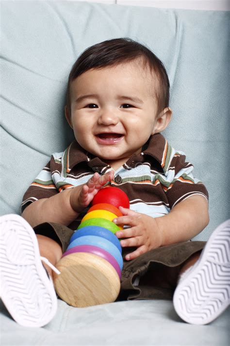 Young Smiling Baby With Toy Stock Photo Image Of Colorful Caucasian
