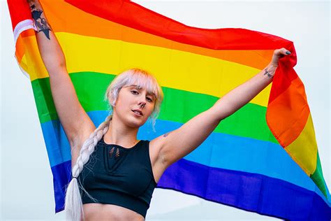 Lesbian Woman With The Flag Of Pride In Sportswear At Gay Parade Photograph By Cavan Images