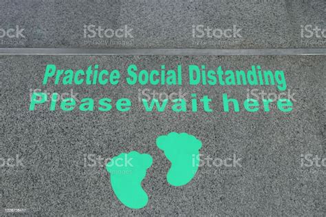 Please Wait Here And Social Distancing Sign Stock Photo Download