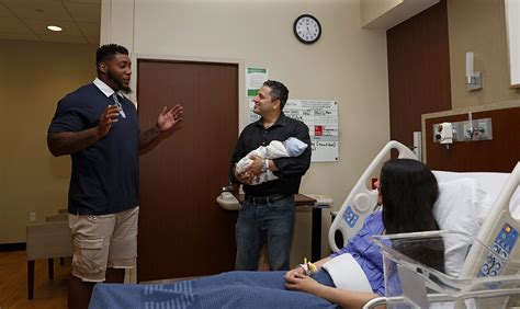 #11 dad and baby matching clothes. Football Pro Devon Still Surprises New Dad at Hospital