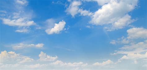 Light Cumulus Clouds In The Blue Sky Wide Photo Stock