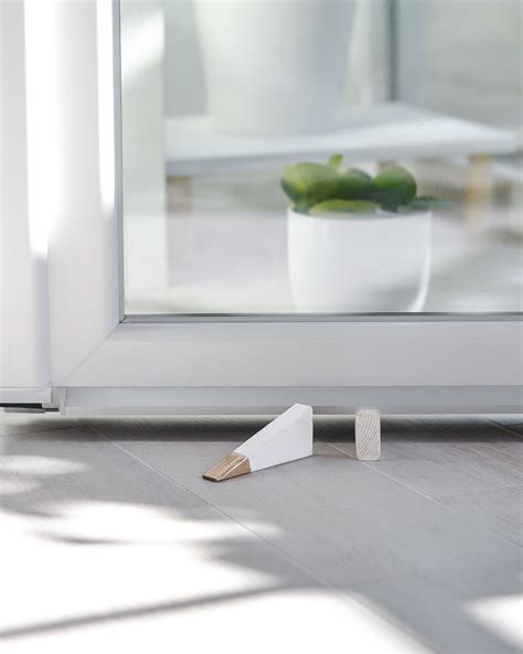 This hangs out of the way when you aren't using it. DIY Stylish Door Stops